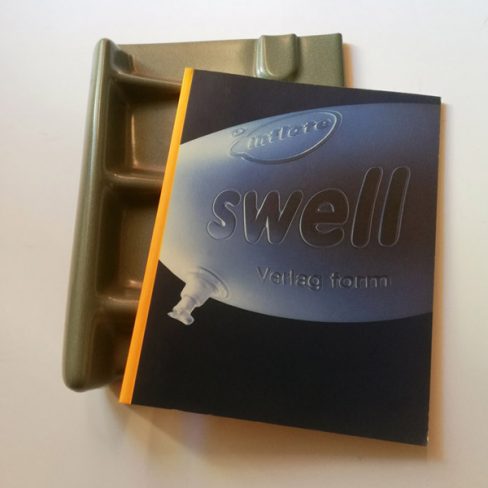 Book with silver hard plastic cover.