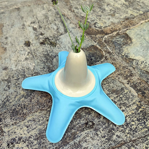 Blue inflatable flower vase with flowers