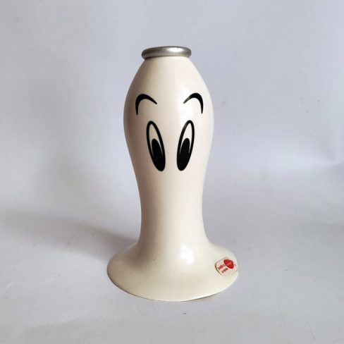 White plastic candle holder.